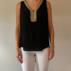 Sleeveless black blouse